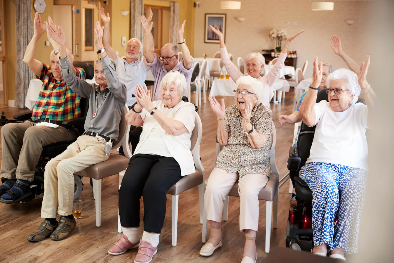 elderly people exercising at a senior assisted living community