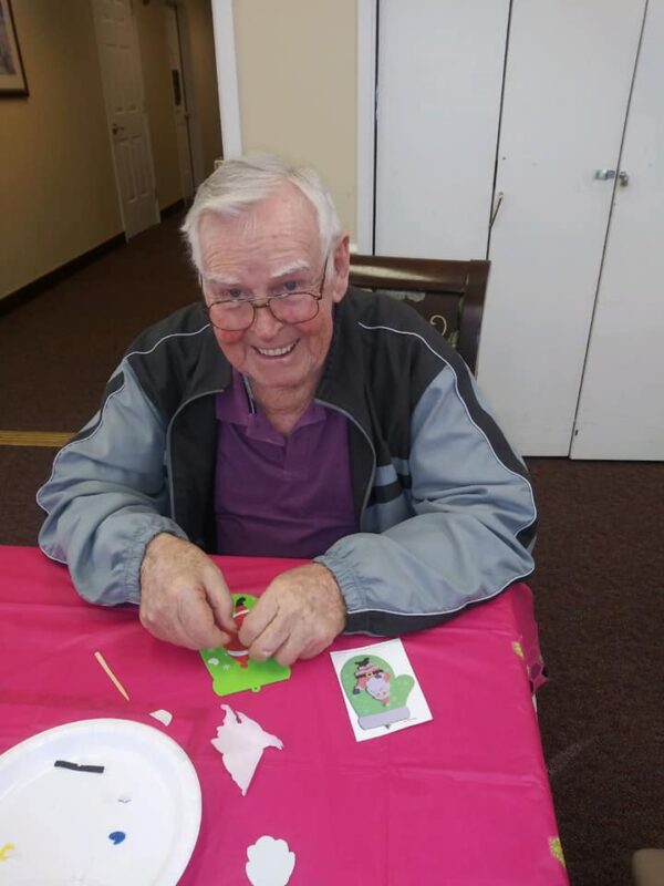 Resident making a card during activity time